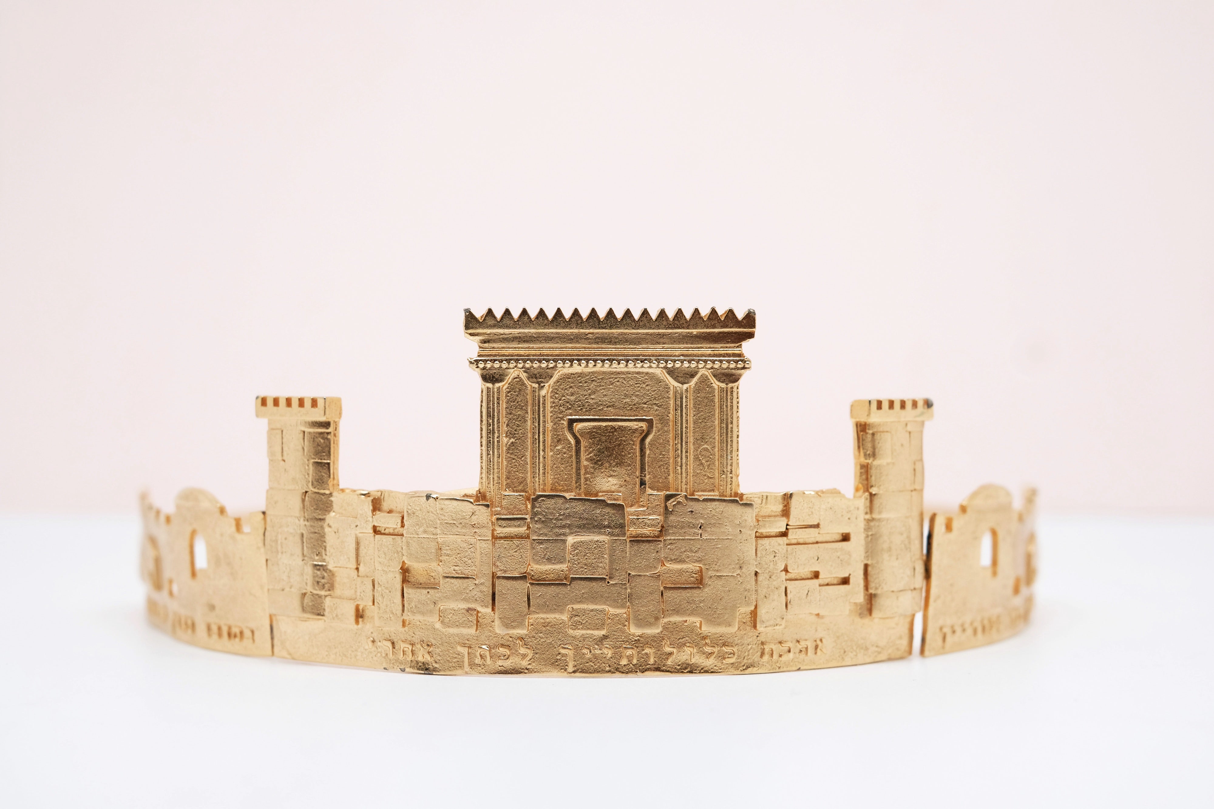 gold plated crown with the western wall details