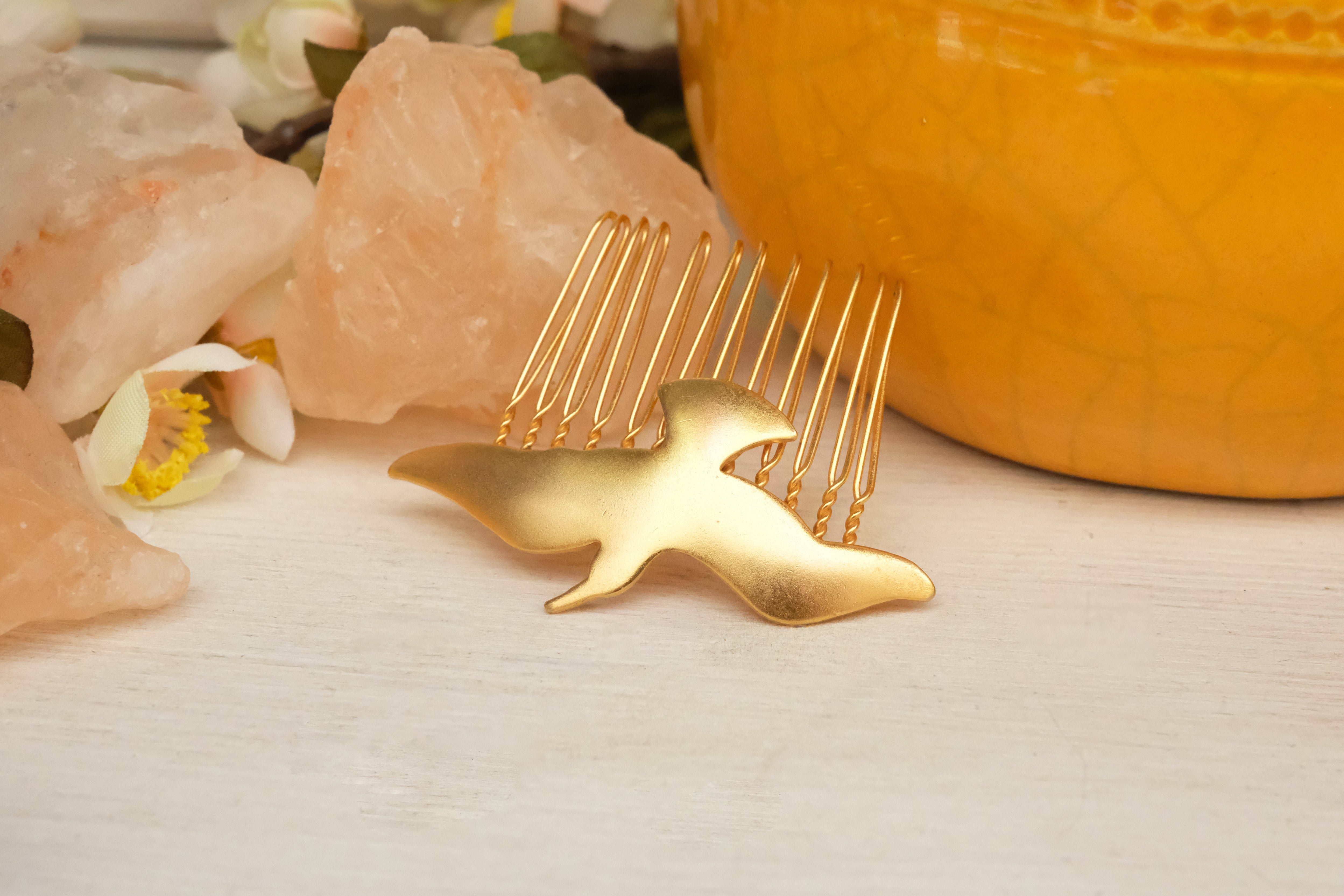 small hair comb with abstract bird detail. in gold plated and silver plated. 