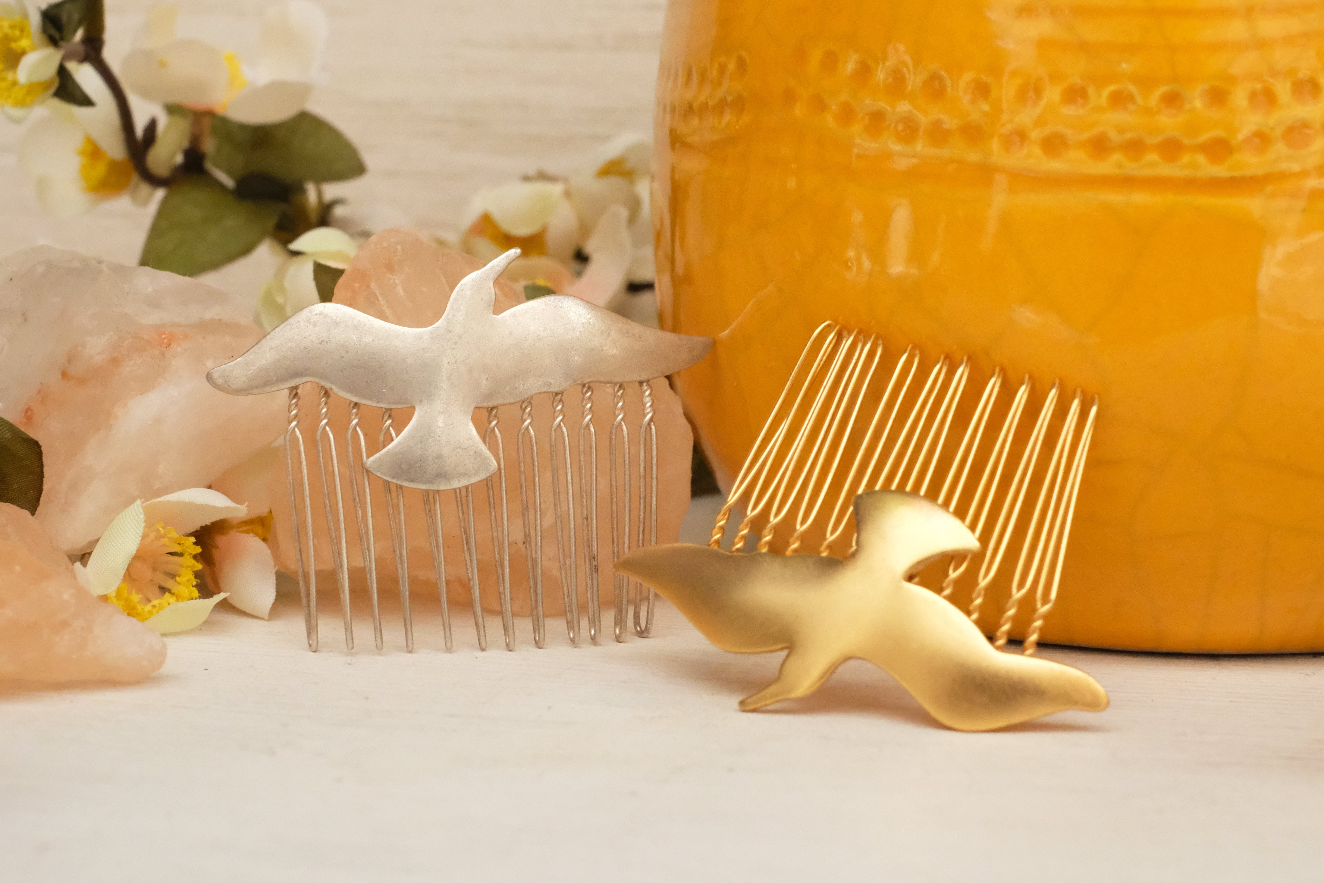 small hair comb with abstract bird detail. in gold plated and silver plated. 