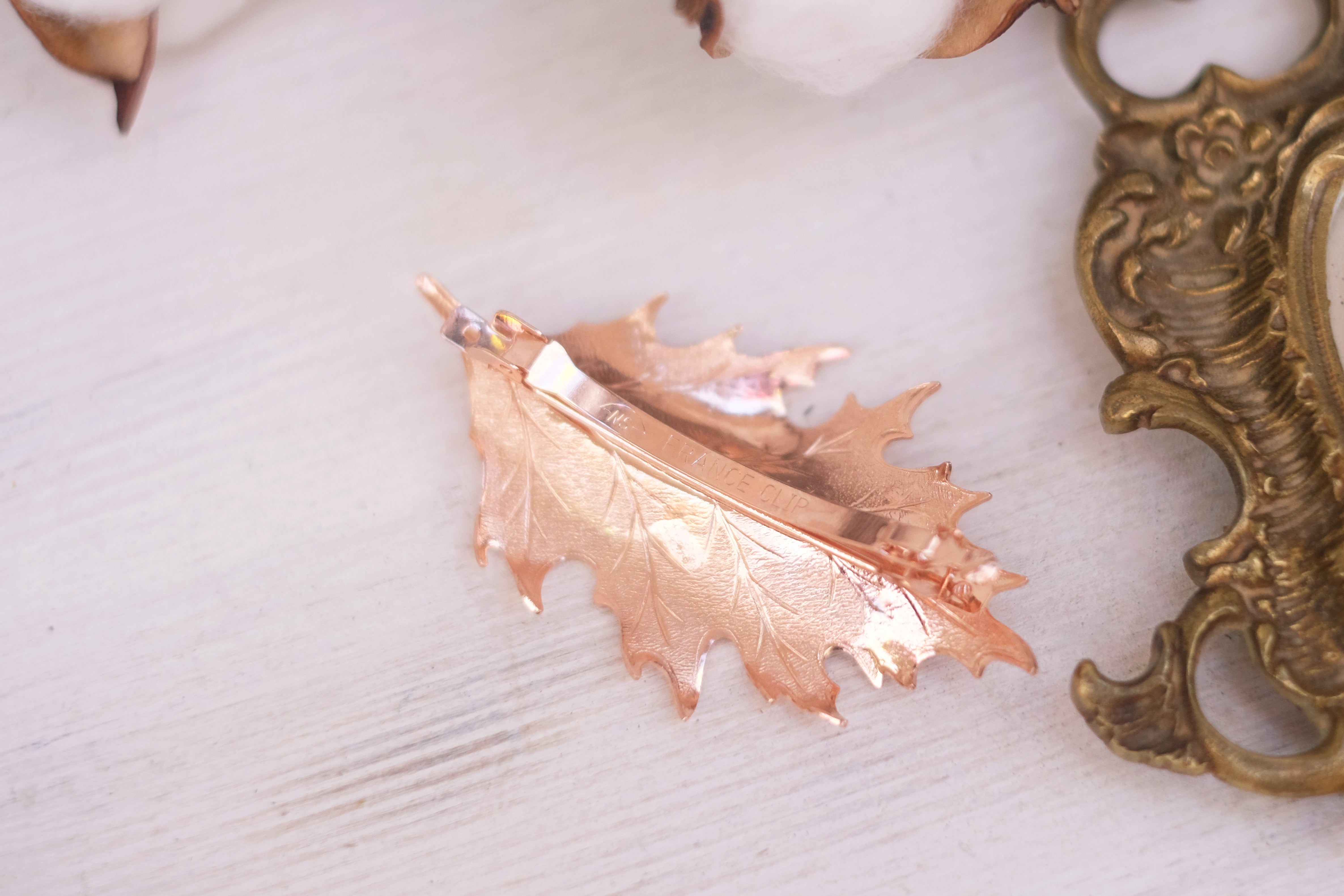 leaf detailed small barrette in gold plated rose gold and oxide silver