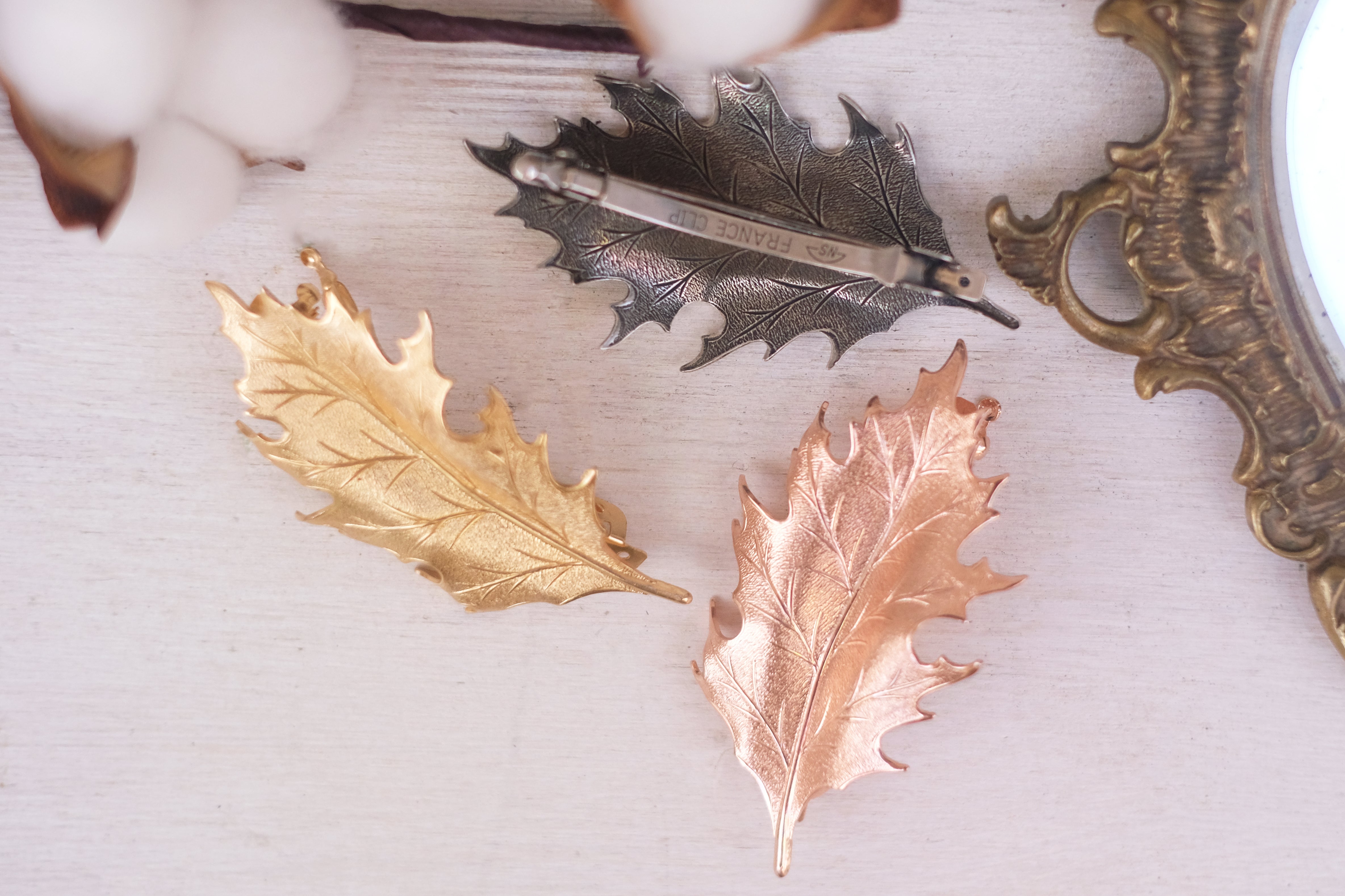 leaf detailed small barrette in gold plated rose gold and oxide silver