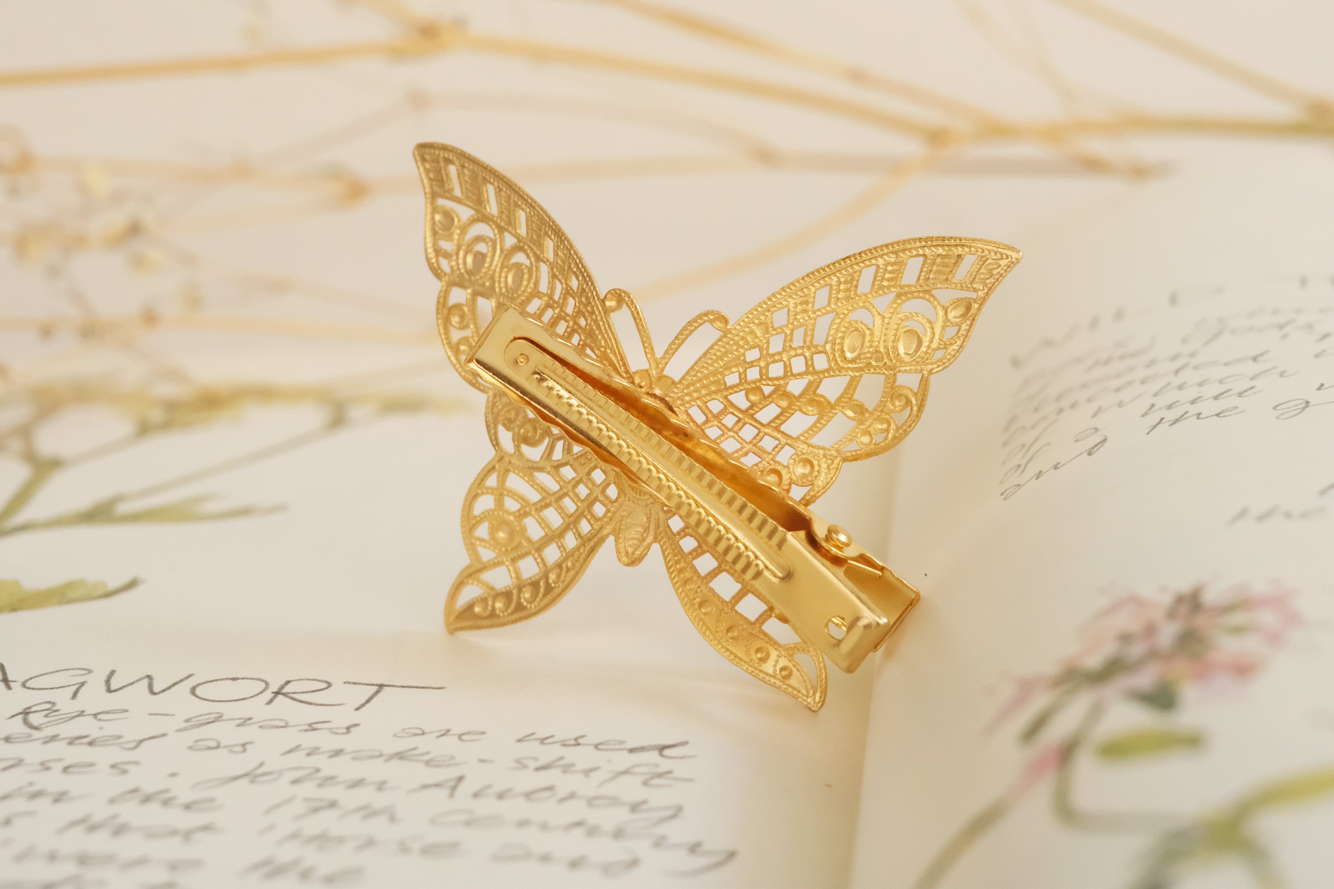 butterfly detailed square claw clip in gold plated silver plated rod gold and oxide silver. 