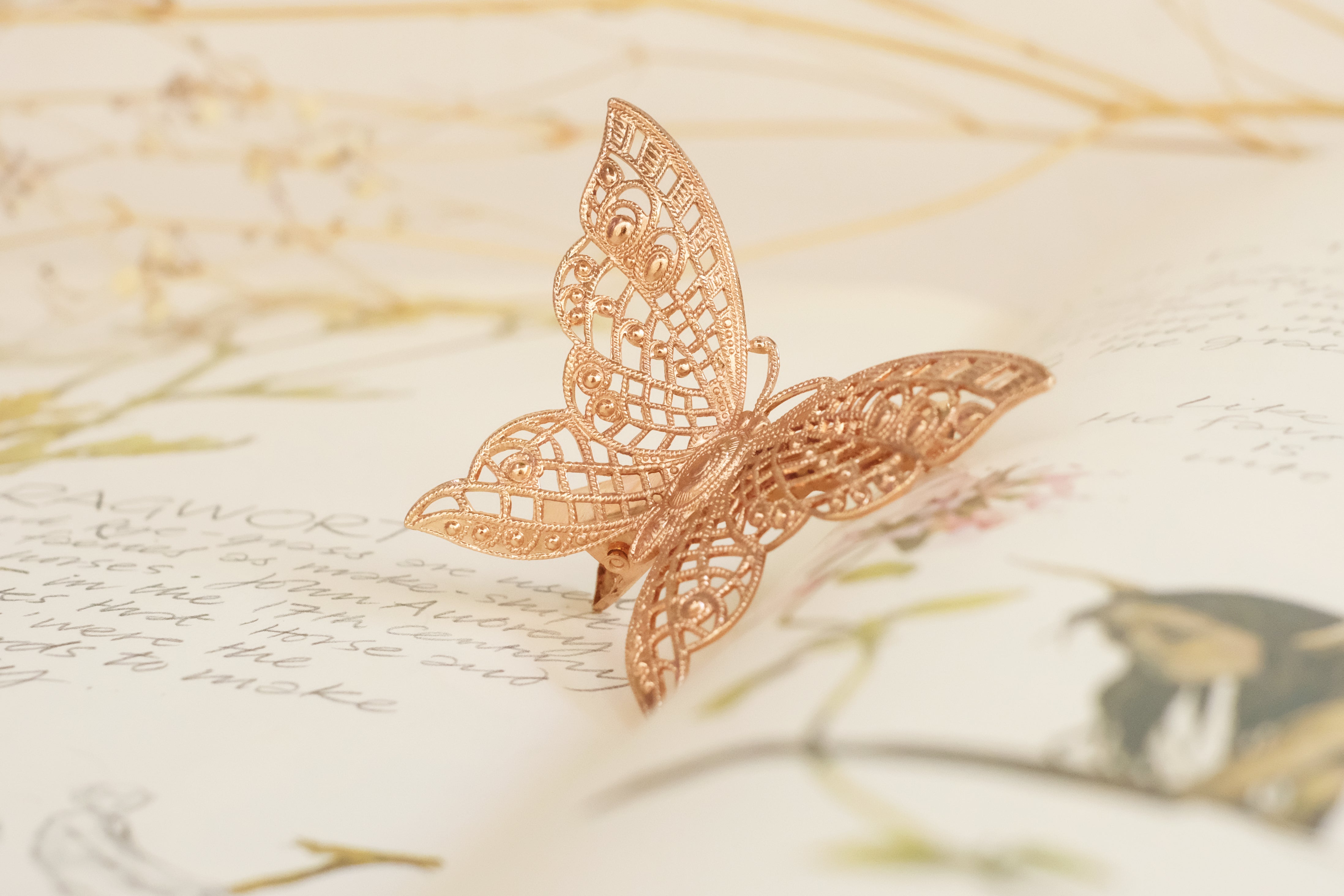 butterfly detailed square claw clip in gold plated silver plated rod gold and oxide silver. 