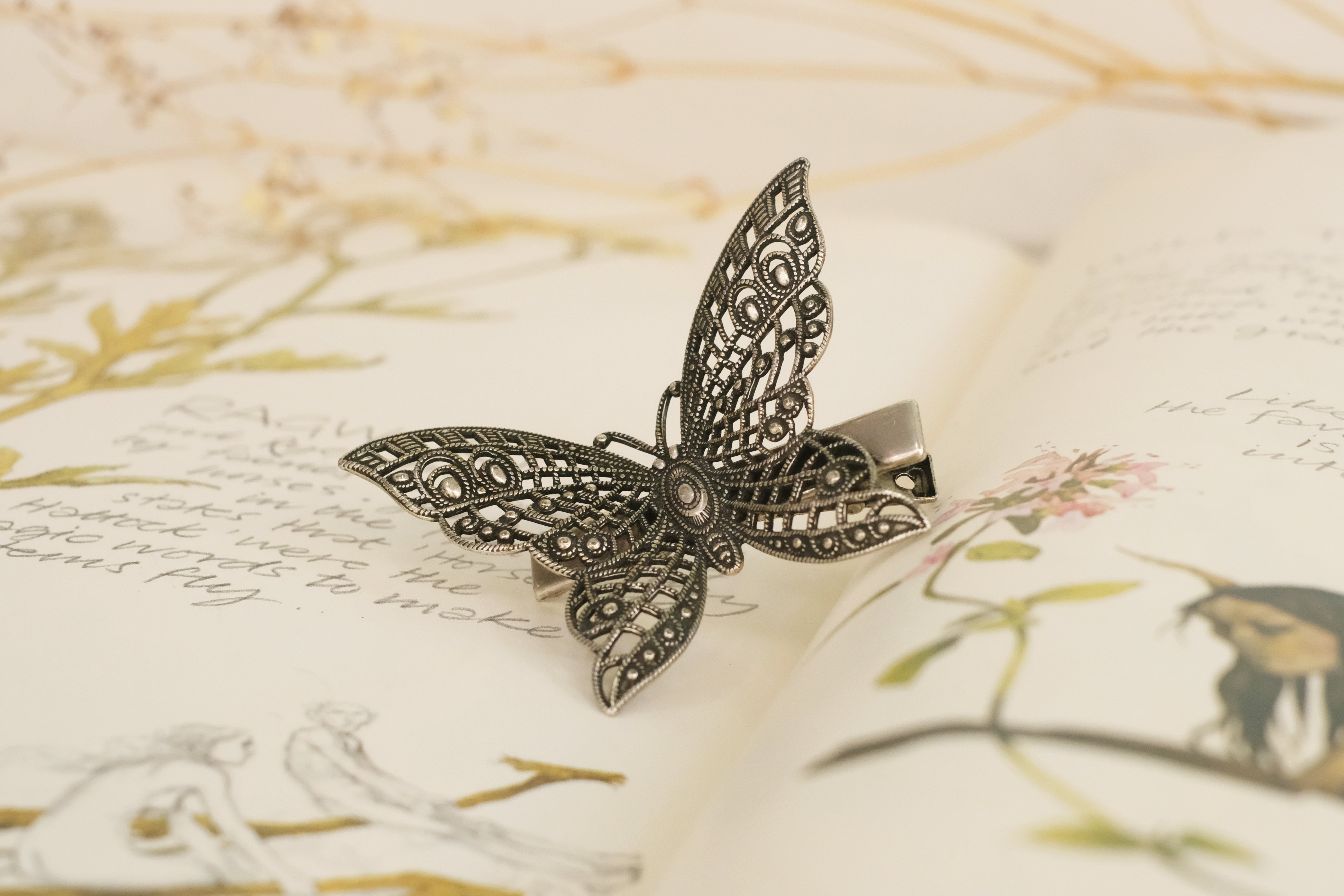 butterfly detailed square claw clip in gold plated silver plated rod gold and oxide silver. 