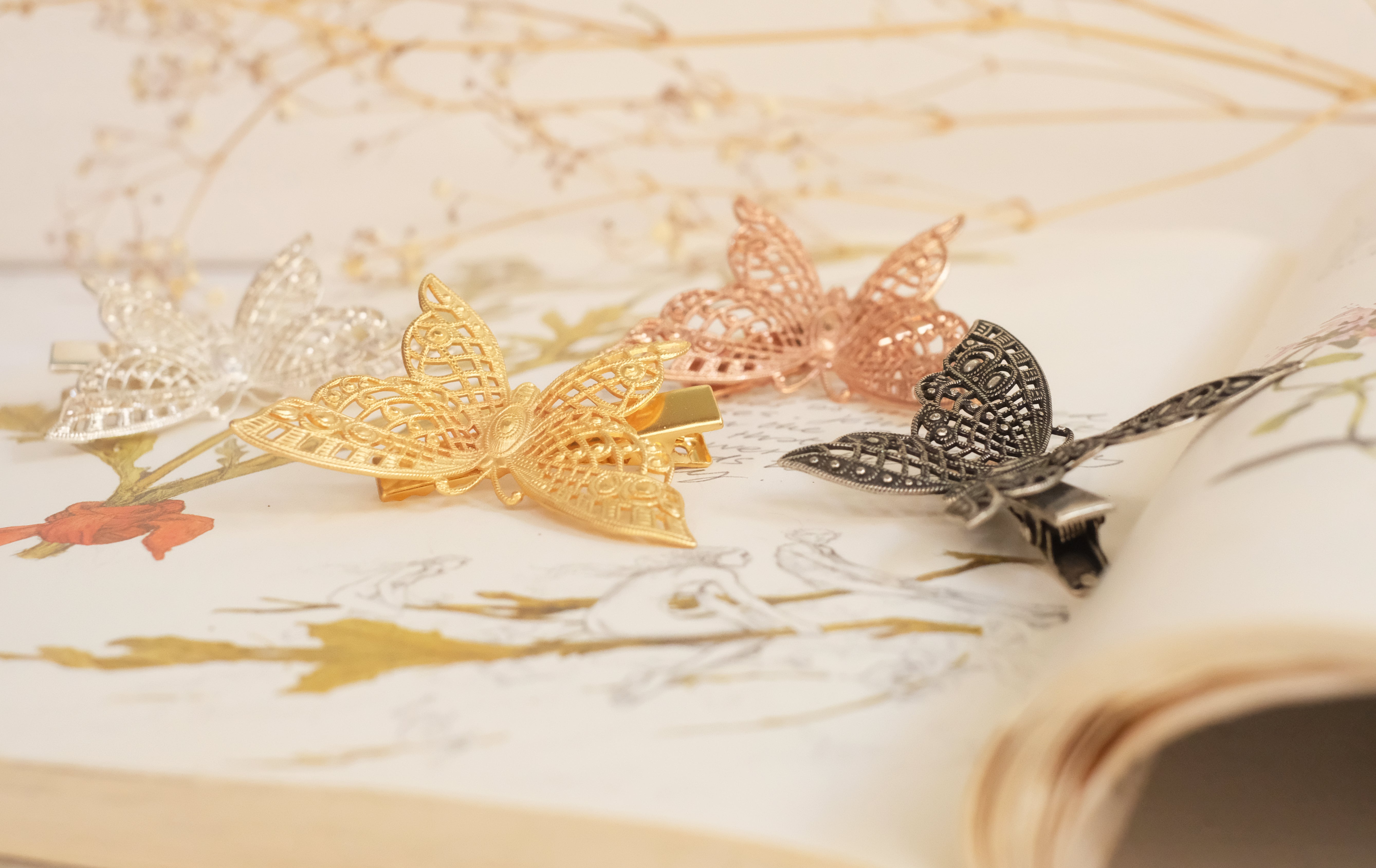 butterfly detailed square claw clip in gold plated silver plated rod gold and oxide silver. 