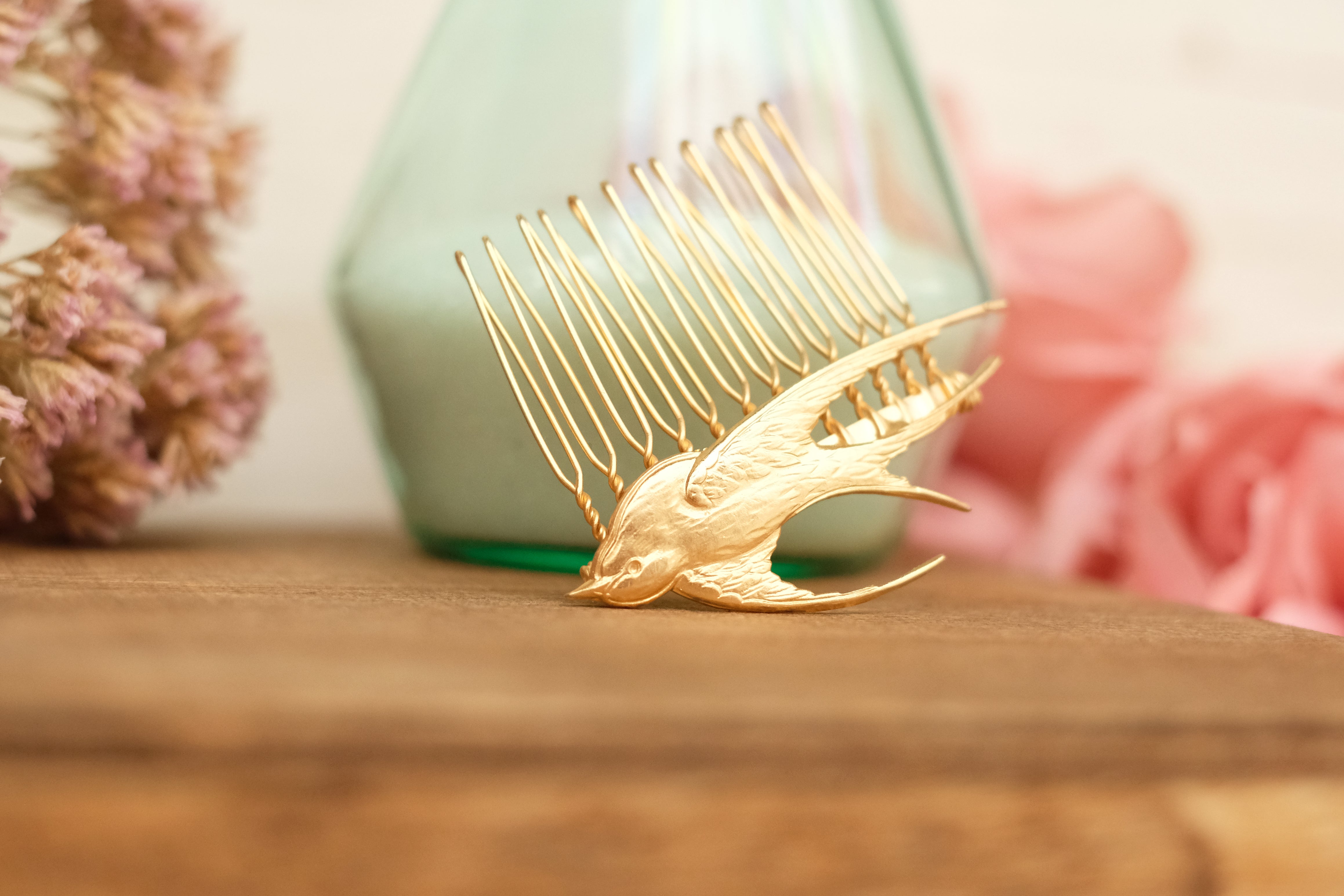 small hair comb with flying bird detail. in rose gold and silver plated