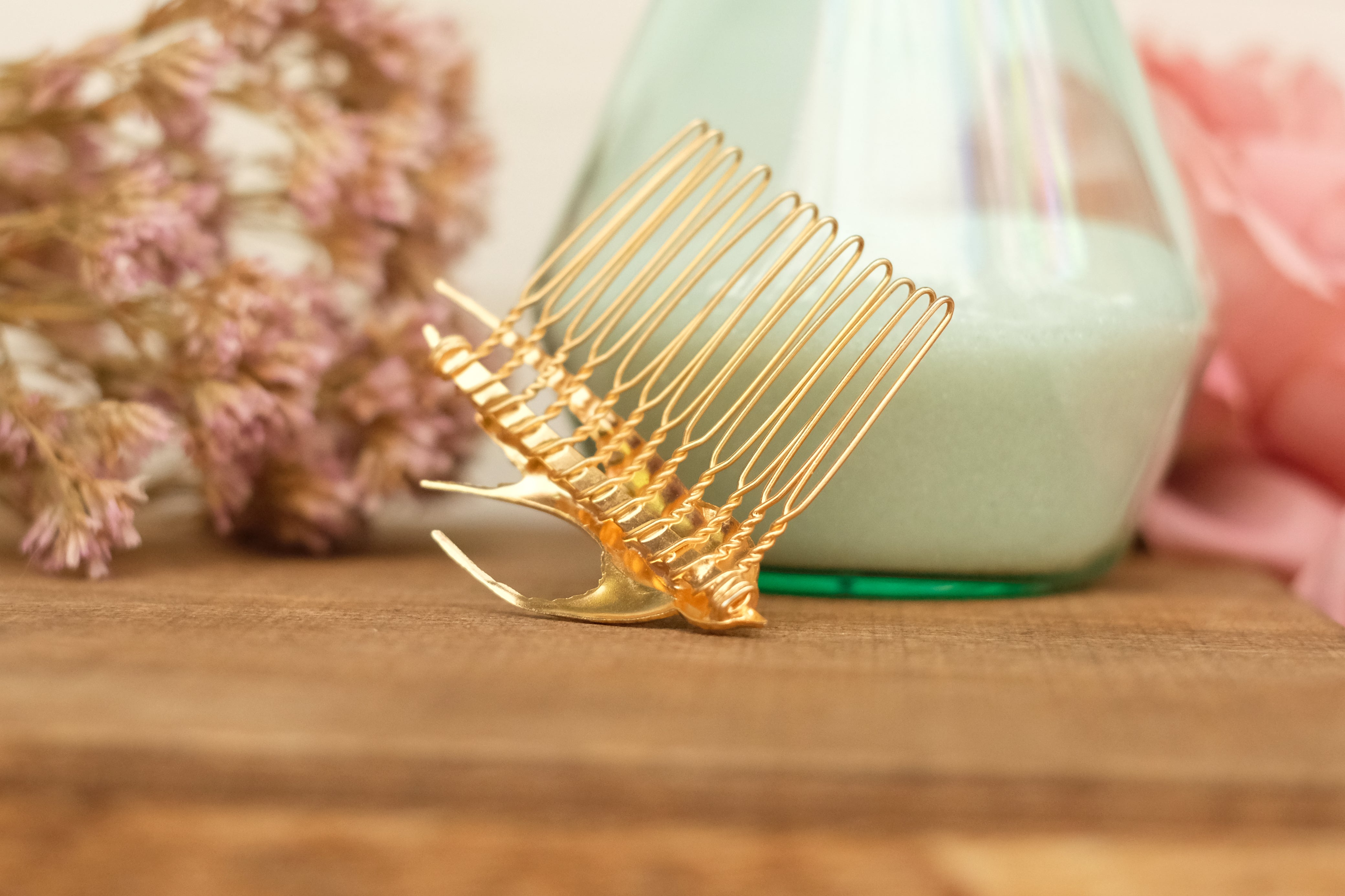 small hair comb with flying bird detail. in rose gold and silver plated