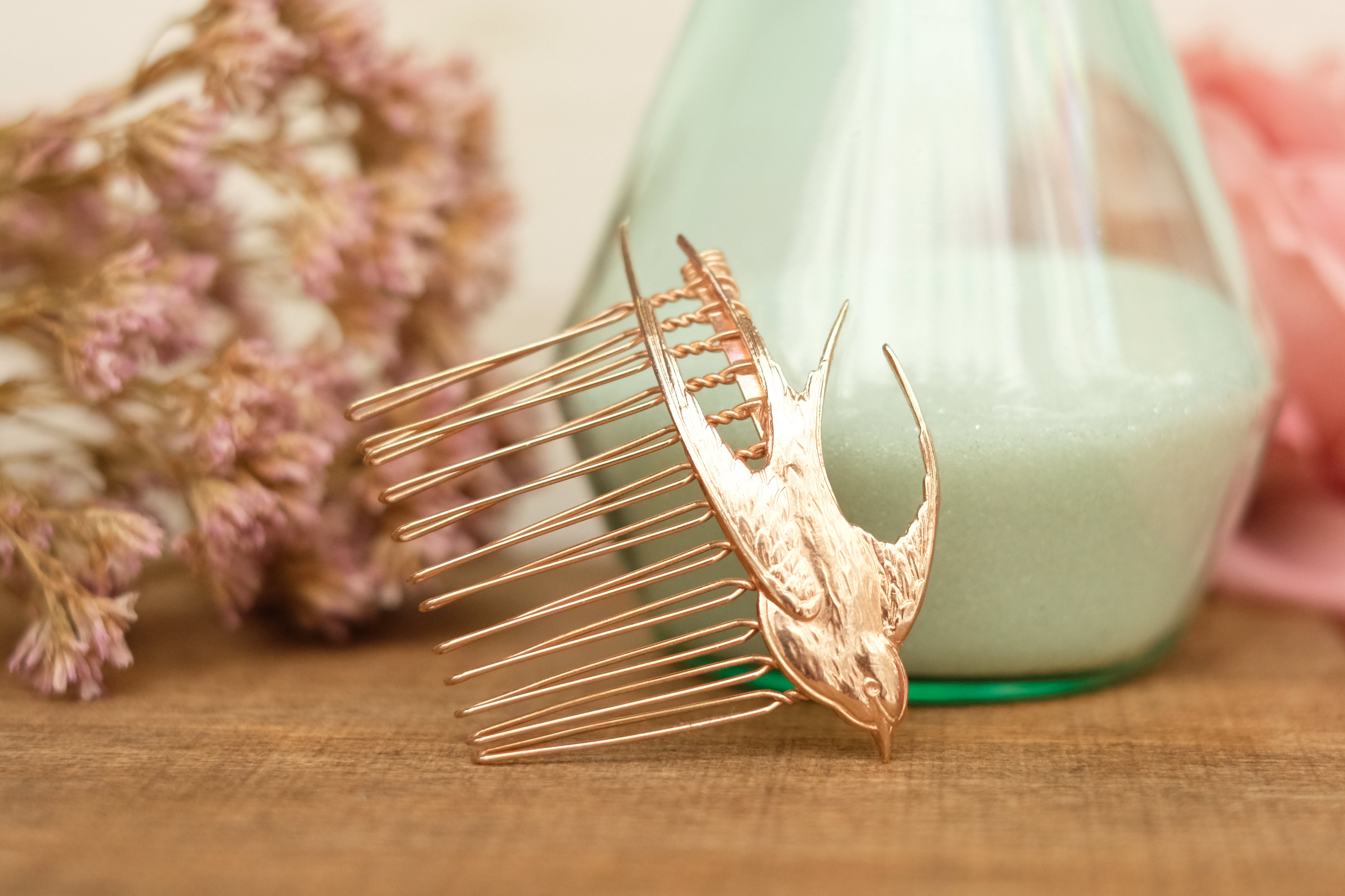 small hair comb with flying bird detail. in rose gold and silver plated