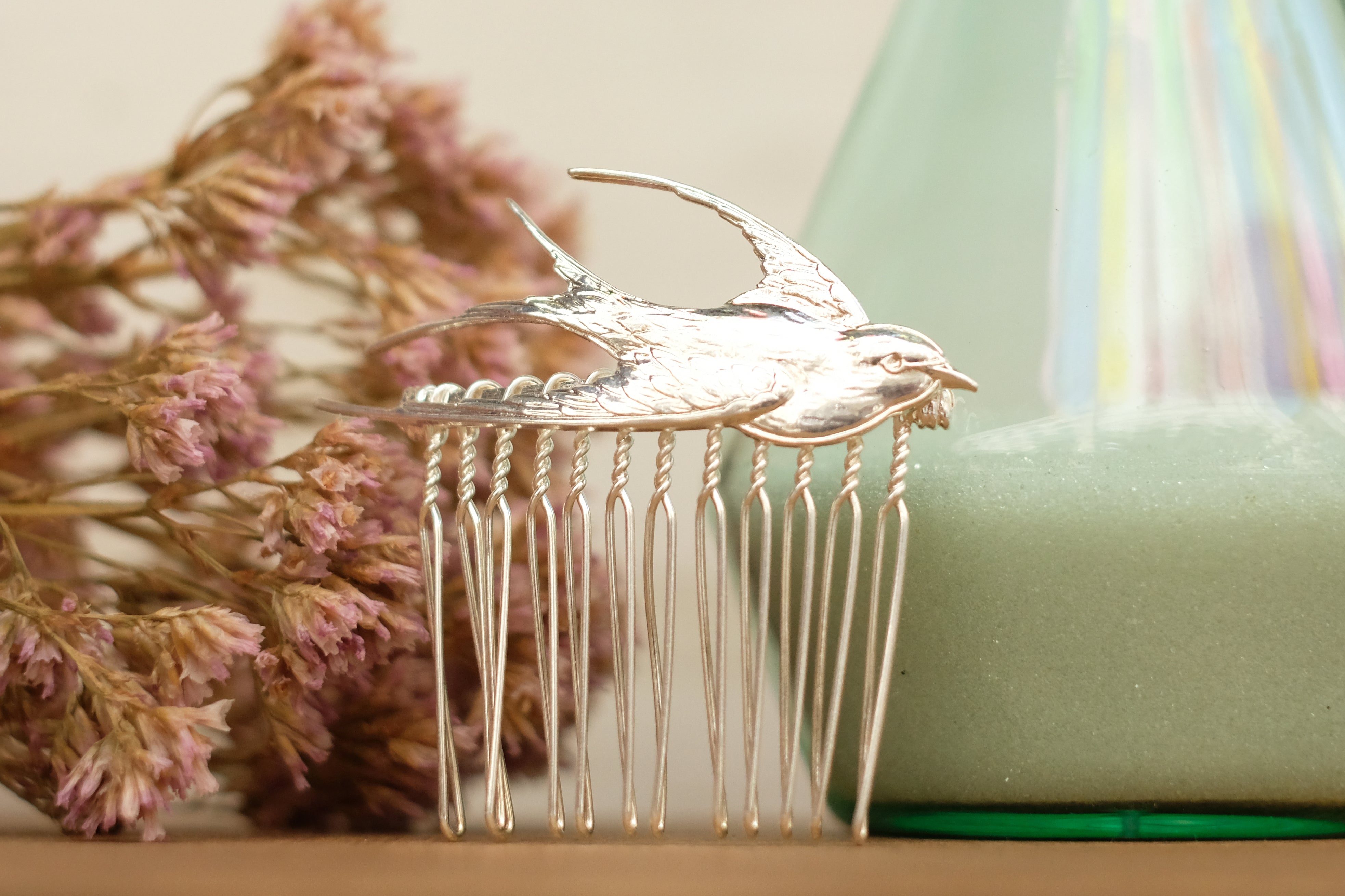 small hair comb with flying bird detail. in rose gold and silver plated