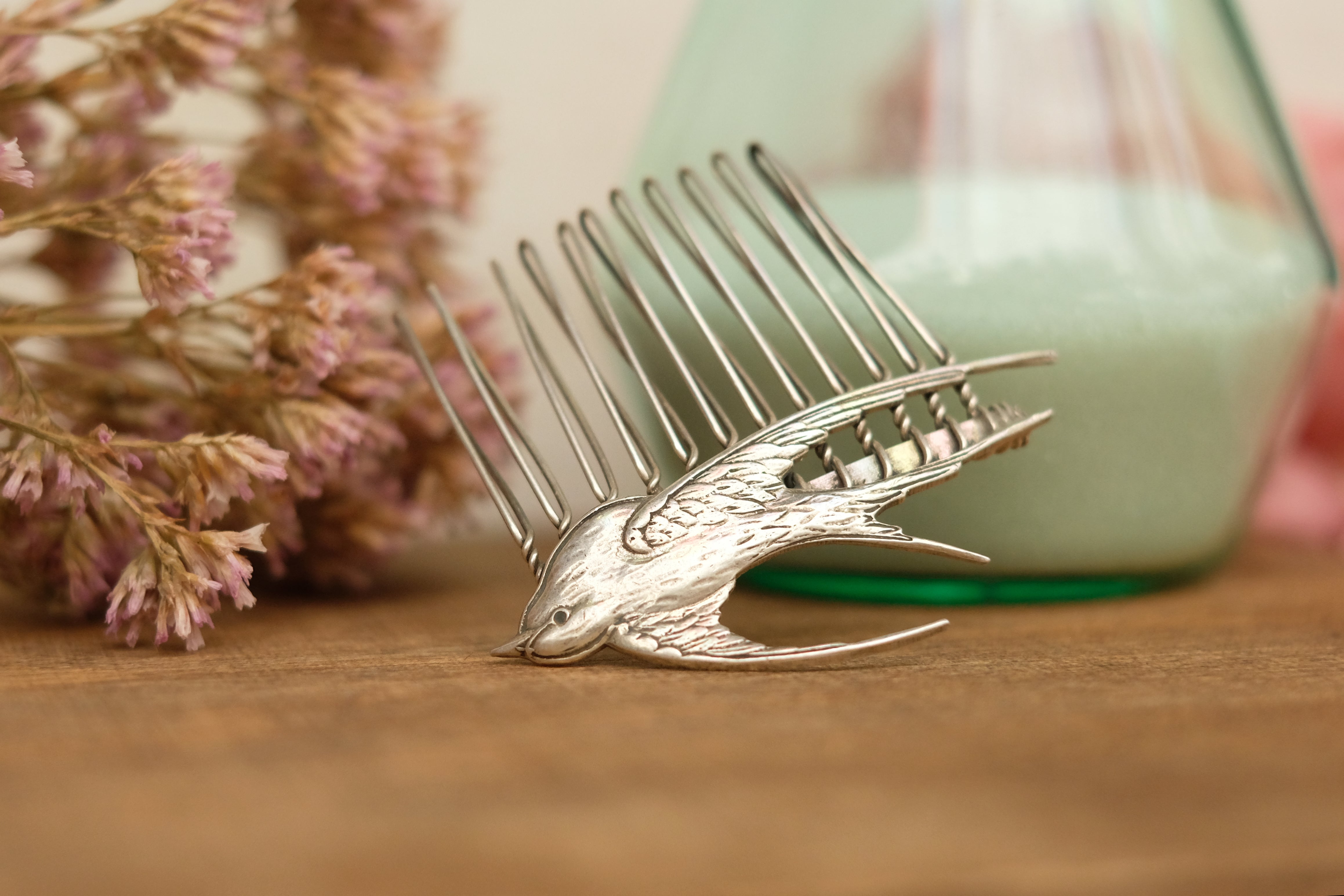 small hair comb with flying bird detail. in rose gold and silver plated