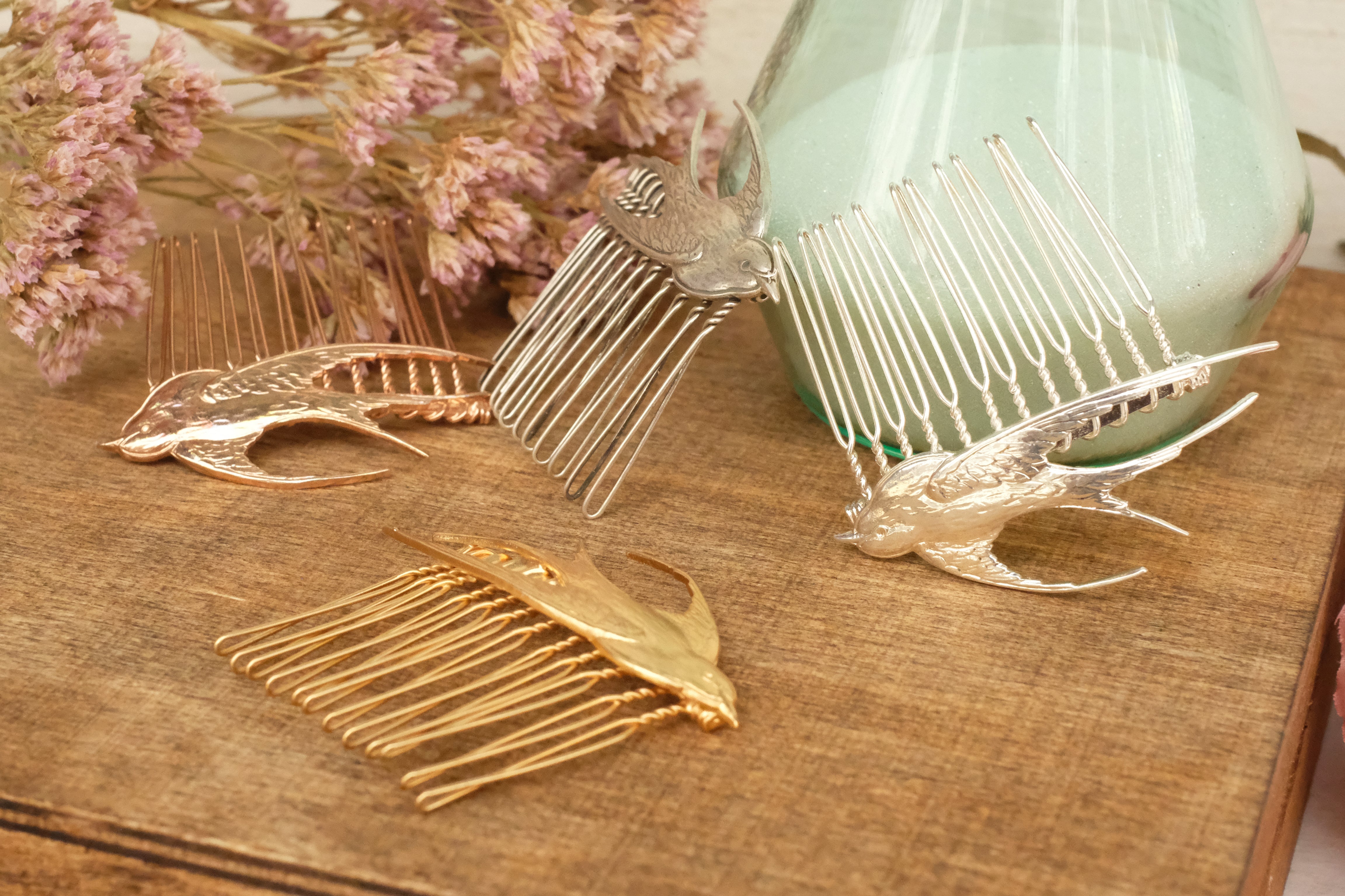 small hair comb with flying bird detail. in rose gold and silver plated